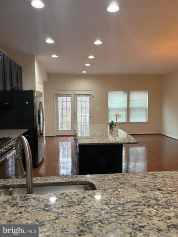 a view of a living room a fireplace and a large window