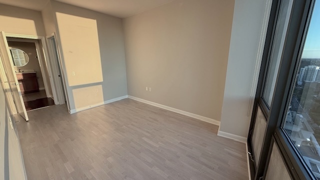 1235 South Prairie Avenue, Unit 3206 Chicago, IL 60605 - Photo 13 of 46 a view of an empty room with wooden floor and a window
