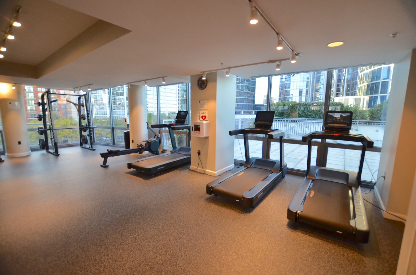 1235 South Prairie Avenue, Unit 3206 Chicago, IL 60605 - Photo 28 of 46 a room with gym equipment and a large window