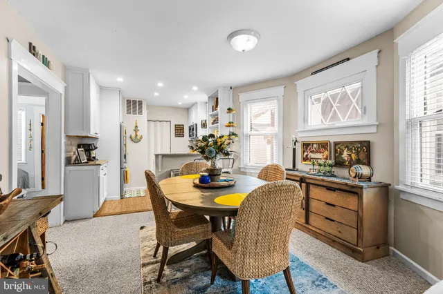 a dining room with furniture and window