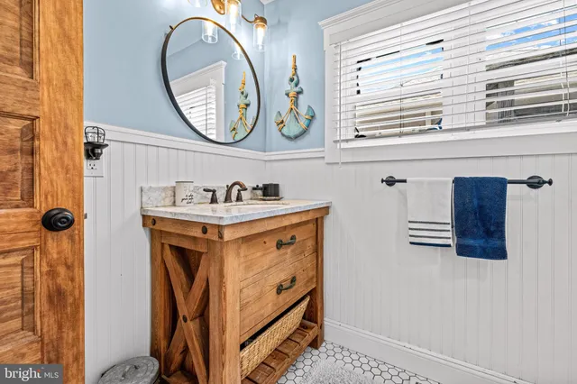 a bathroom with a sink and a mirror