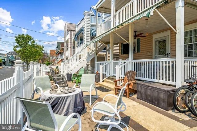 a view of a patio with a table and chairs