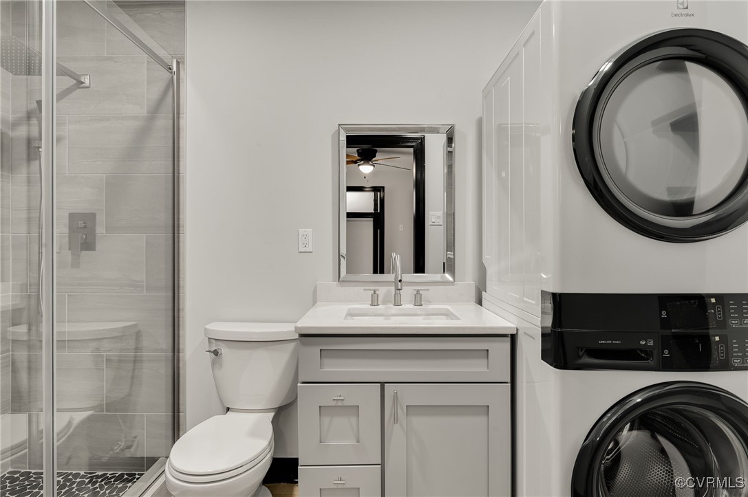 102 Riva Ridge Circle Sandston, VA 23150 - Photo 14 of 23 Bathroom with stacked washer and dryer, a stall sh