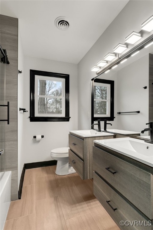 102 Riva Ridge Circle Sandston, VA 23150 - Photo 19 of 23 Bathroom featuring double vanity, baseboards, visi