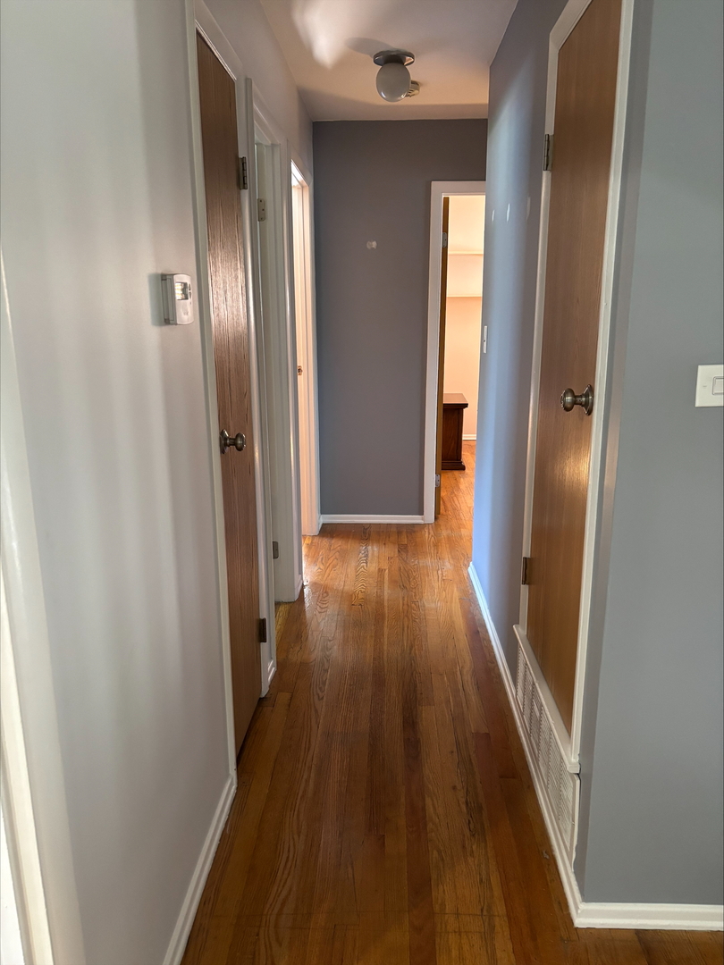 21W246 Audubon Road Lombard, IL 60148 - Photo 13 of 19 a view of a hallway with wooden floor