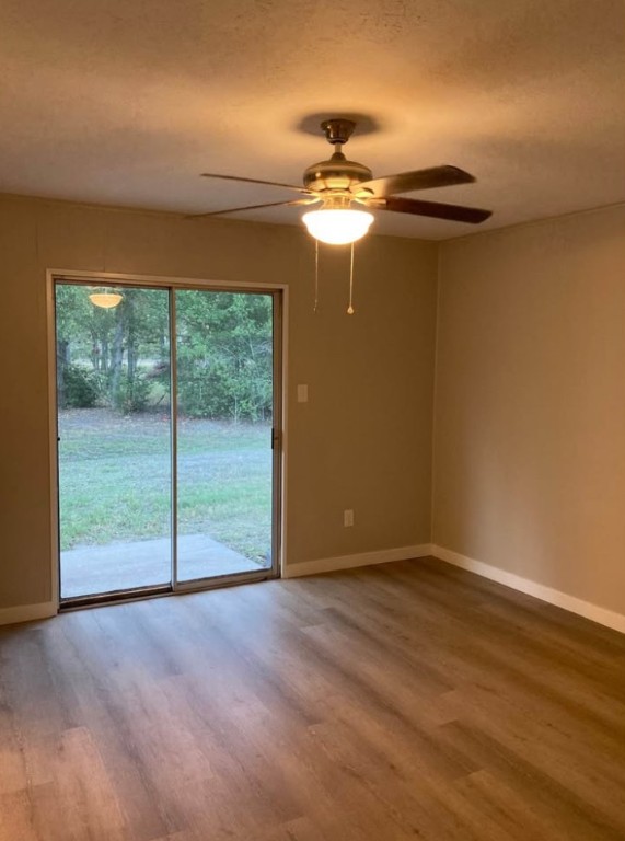 4958 Schehin Road College Station, TX 77845 - Photo 6 of 9 a view of empty room with wooden floor