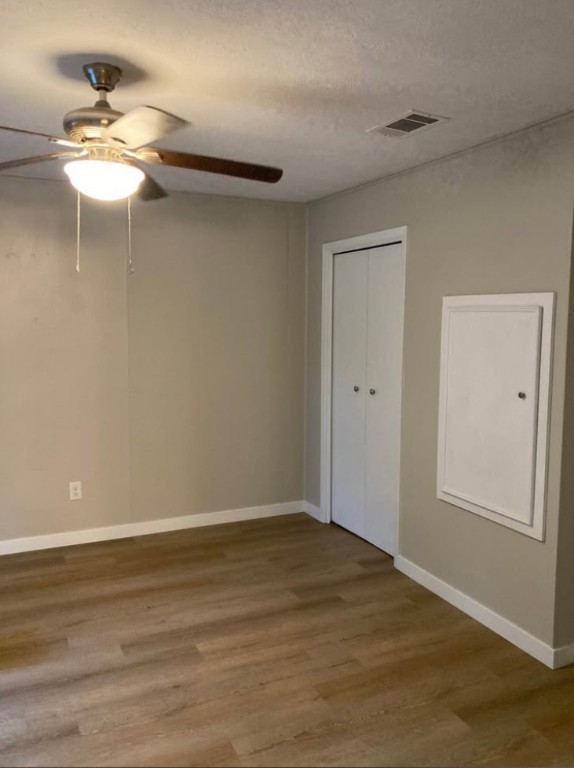 4958 Schehin Road College Station, TX 77845 - Photo 7 of 9 a view of a room with wooden floor and fan