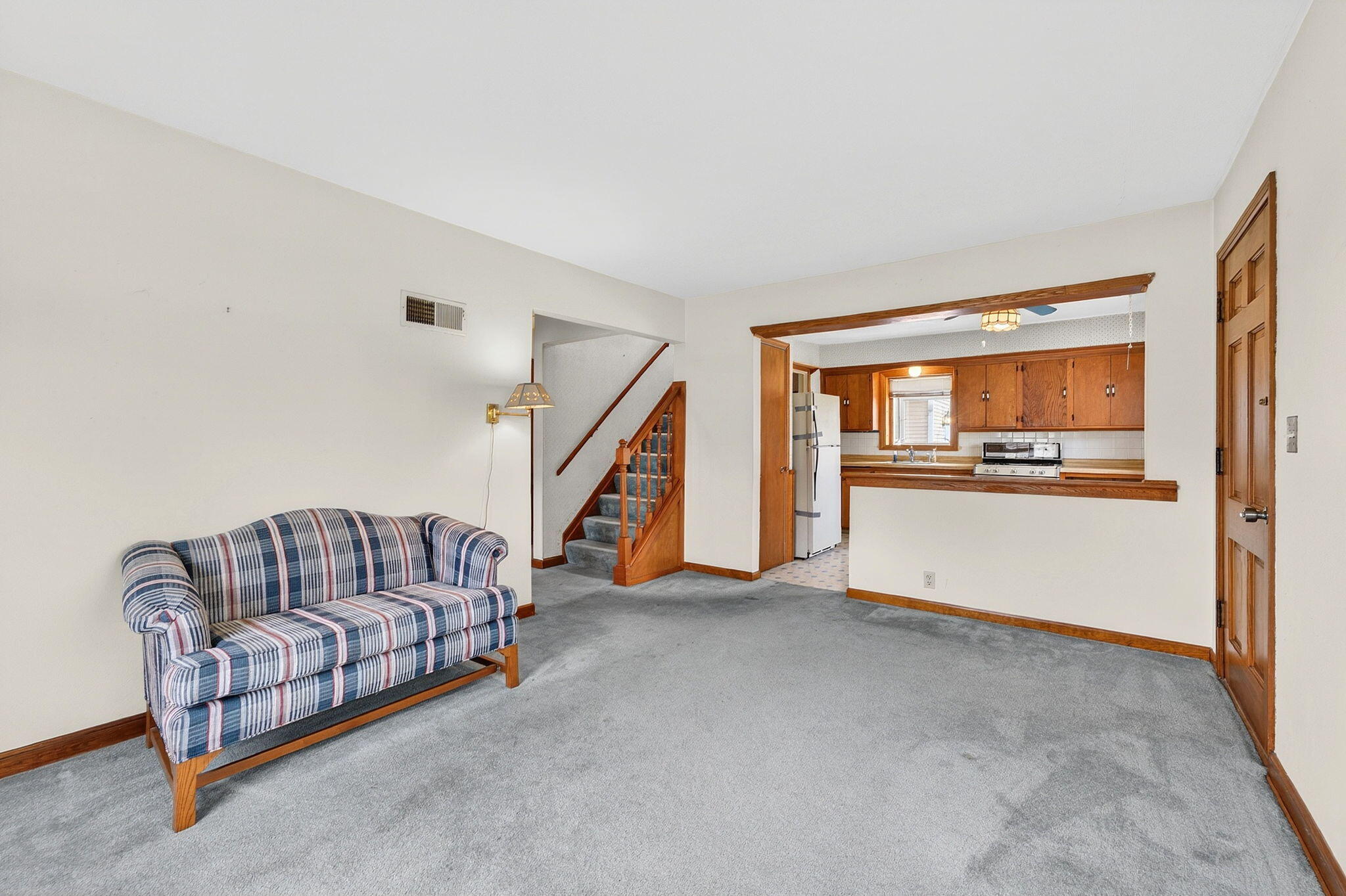 980 South Webster Avenue Brookfield, WI 53005 - Photo 7 of 29 From Living Room looking into kitchen and up stairwell
