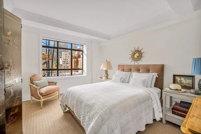 a bathroom with a sink toilet a mirror and shower