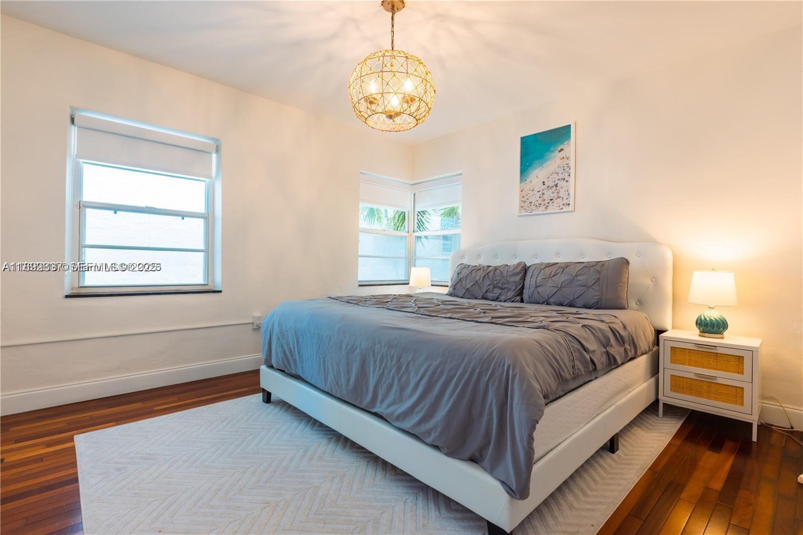 426 Northeast 26th Street, Unit 1 Miami, FL 33137 - Photo 12 of 23 a bedroom with a bed and a window