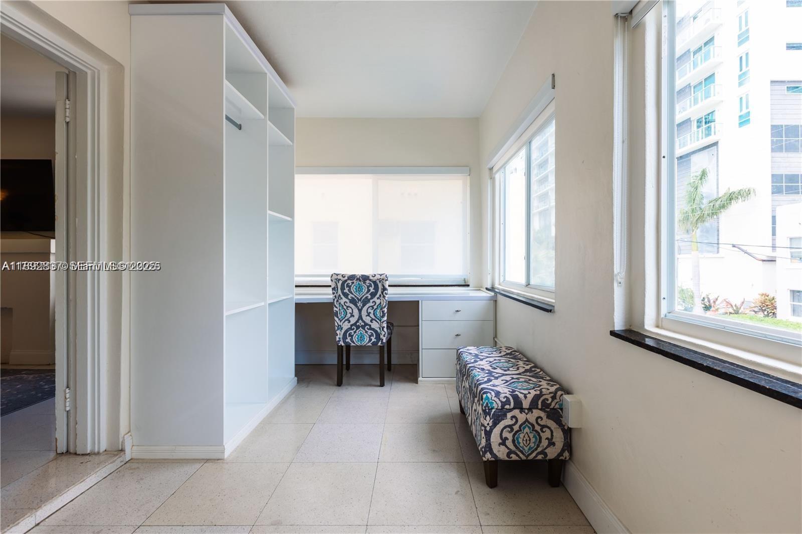 426 Northeast 26th Street, Unit 1 Miami, FL 33137 - Photo 13 of 23 a balcony with furniture and a window