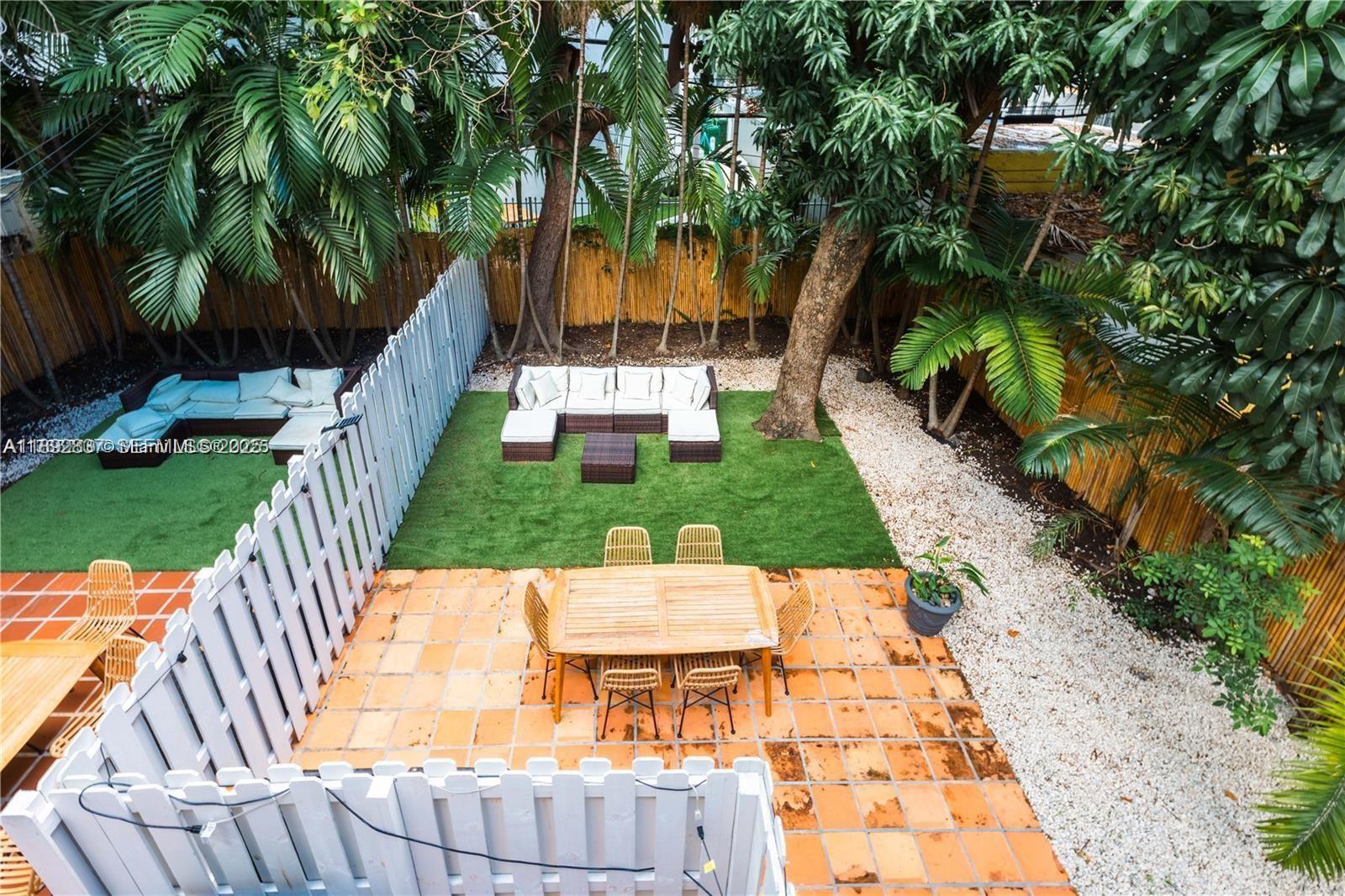 426 Northeast 26th Street, Unit 1 Miami, FL 33137 - Photo 3 of 23 a view of yard with swimming pool and outdoor seating
