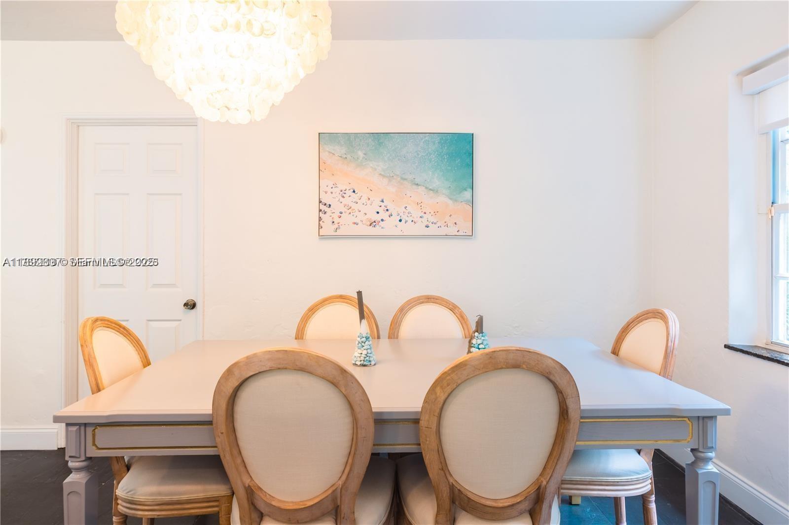 426 Northeast 26th Street, Unit 1 Miami, FL 33137 - Photo 5 of 23 a bathroom with a toilet a sink and a mirror