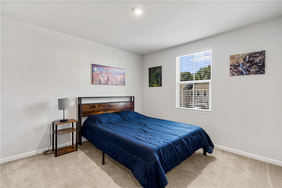 115 Queens Mill Court Pendleton, SC 29670 - Photo 24 of 32 A window overlooks the outdoors in this comfortable bedroom featuring soft carpet flooring.