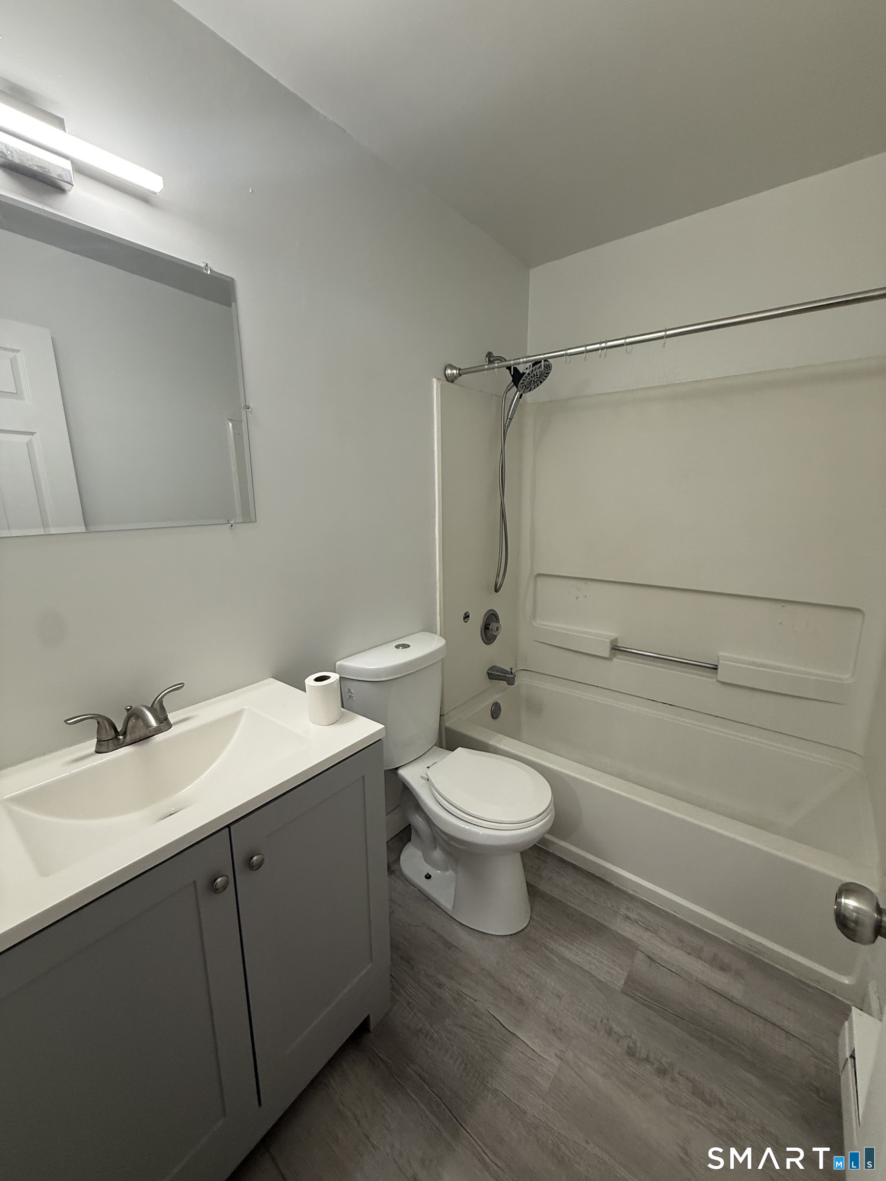 264 Scott Road, Unit 7 Waterbury, CT 06705 - Photo 5 of 10 a bathroom with a toilet sink vanity granite and shower