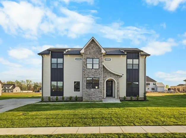 a front view of a house with a yard