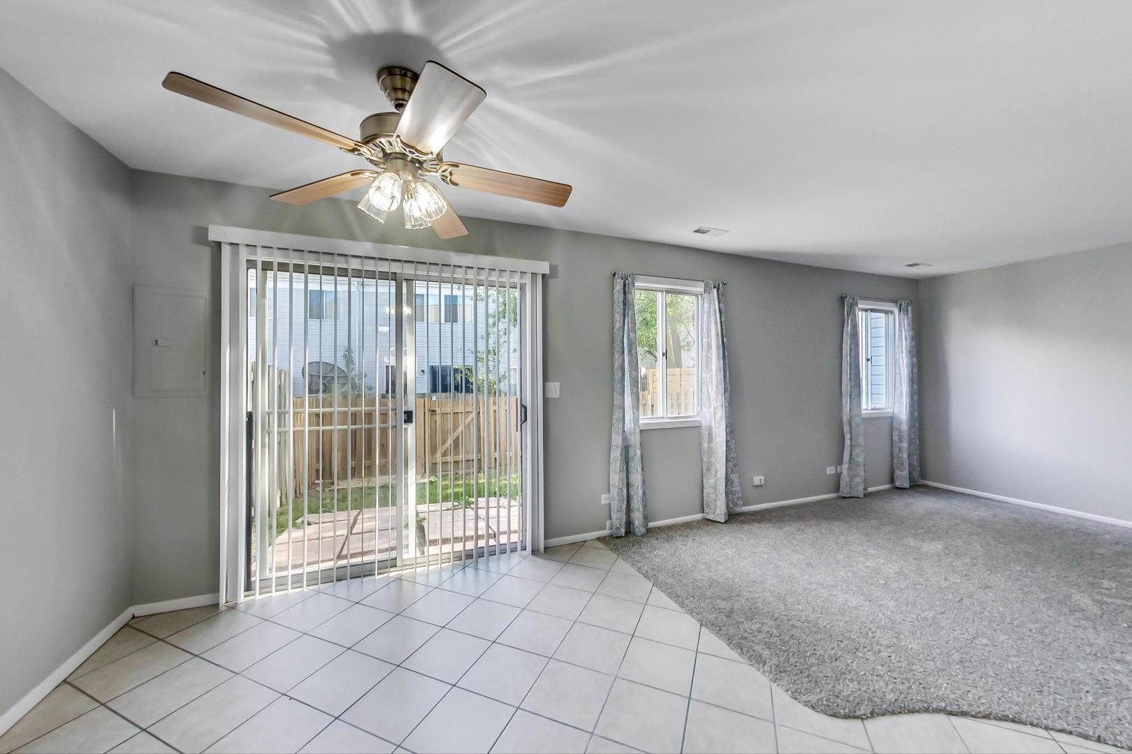 822 Minnesota Circle Carol Stream, IL 60188 - Photo 5 of 14 a view of empty room with wooden floor