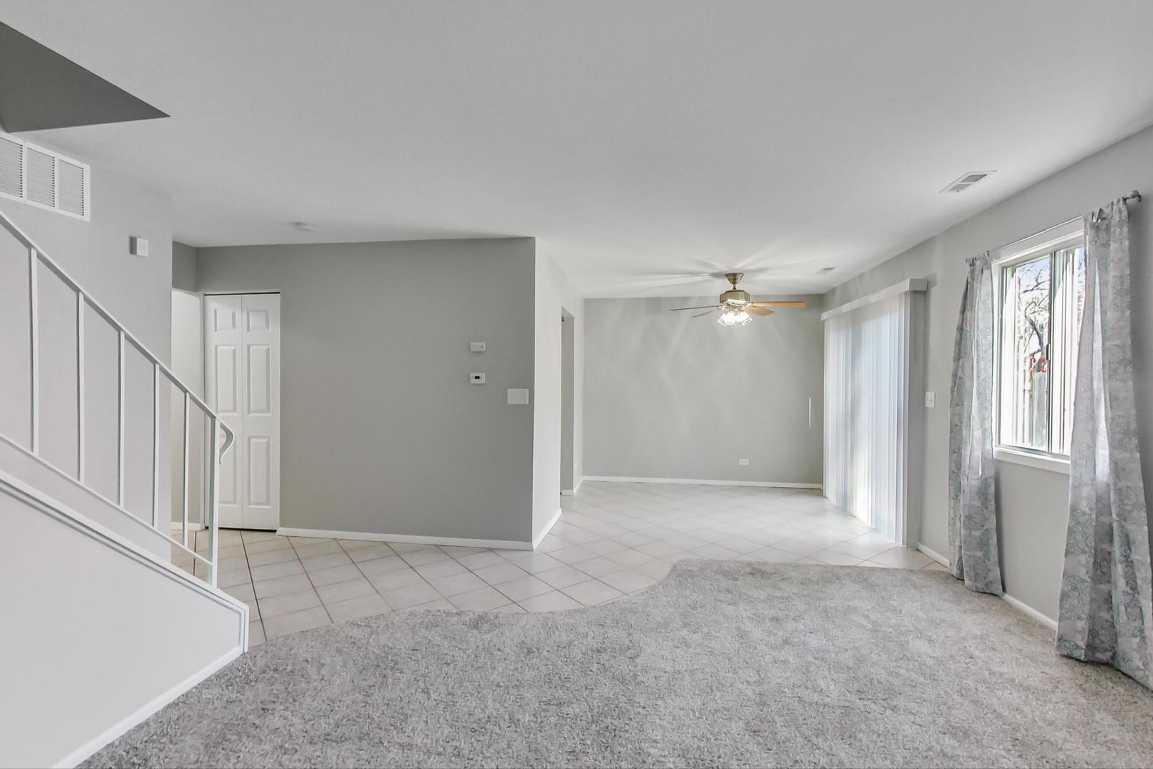 822 Minnesota Circle Carol Stream, IL 60188 - Photo 6 of 14 a view of an empty room with a window