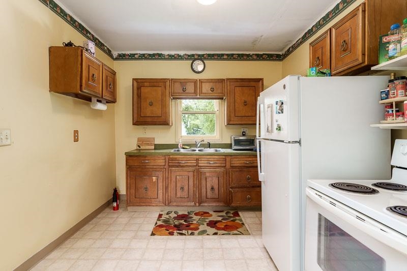 3982 Pann Road South Beloit, IL 61080 - Photo 54 of 84 a kitchen with stainless steel appliances granite countertop a refrigerator and a stove