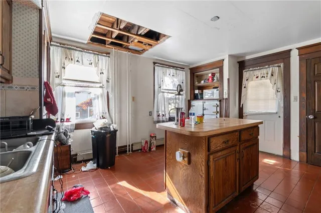 a kitchen with granite countertop a stove and a refrigerator