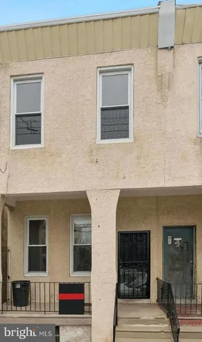 a front view of a house with large windows