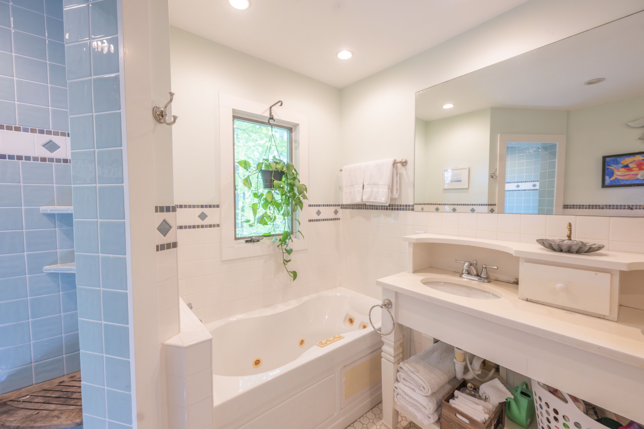 3442 Sherwood Road Sewanee, TN 37375 - Photo 20 of 28 a bathroom with a tub sink and mirror