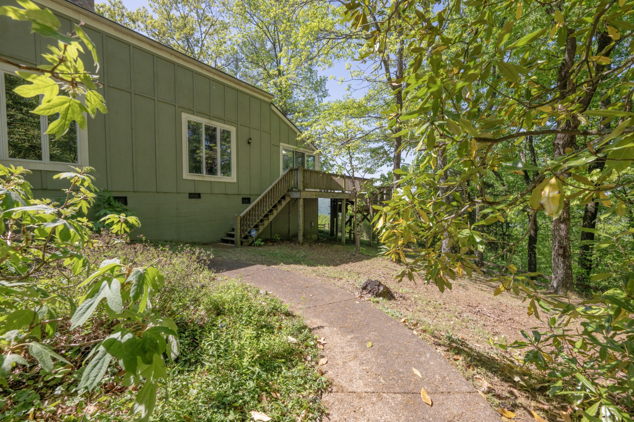 3442 Sherwood Road Sewanee, TN 37375 - Photo 2 of 28 a front view of a house with a yard