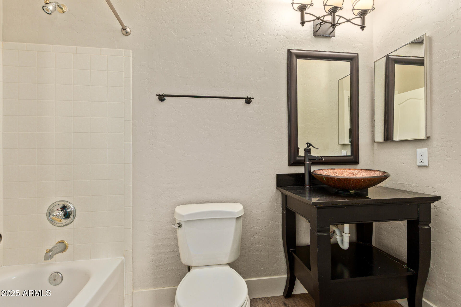 3060 North Ridgecrest, Unit 171 Mesa, AZ 85207 - Photo 13 of 31 a bathroom with a sink a toilet and bathtub