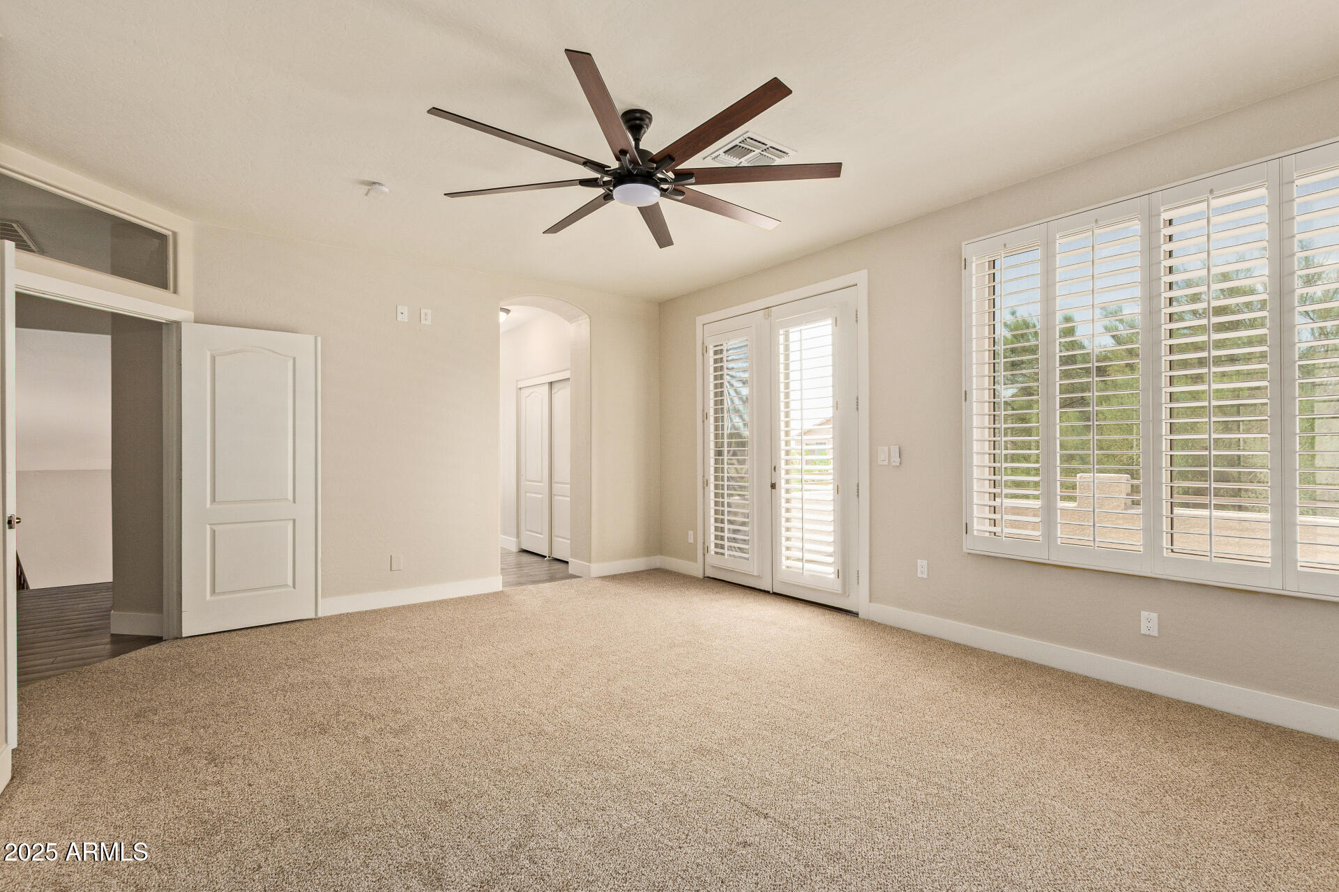 3060 North Ridgecrest, Unit 171 Mesa, AZ 85207 - Photo 15 of 31 a view of a livingroom with a ceiling fan and window