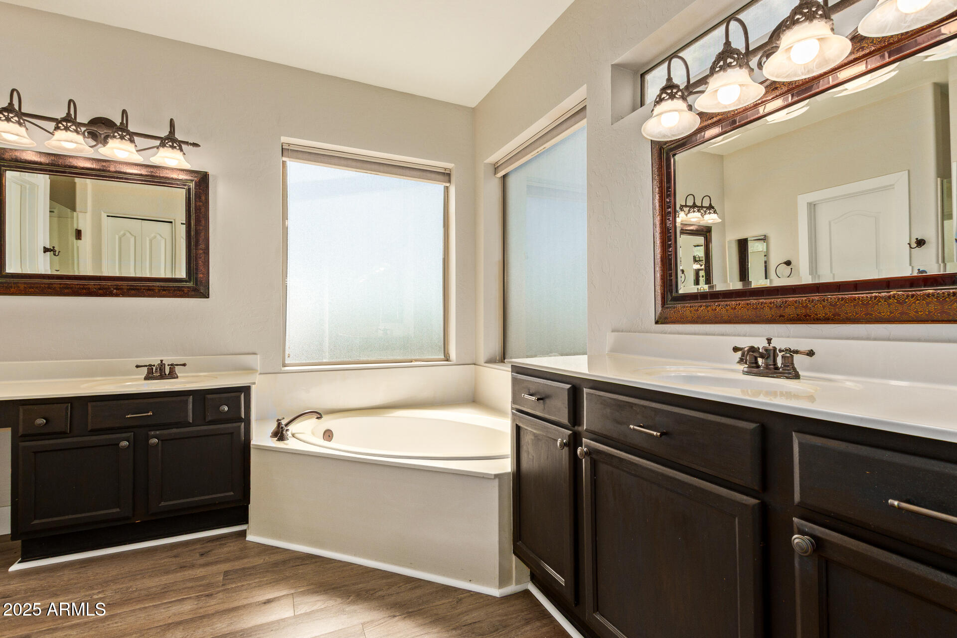 3060 North Ridgecrest, Unit 171 Mesa, AZ 85207 - Photo 18 of 31 a bathroom with a tub sink and mirror