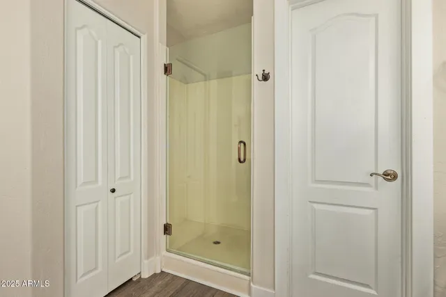 a bathroom with a glass shower door