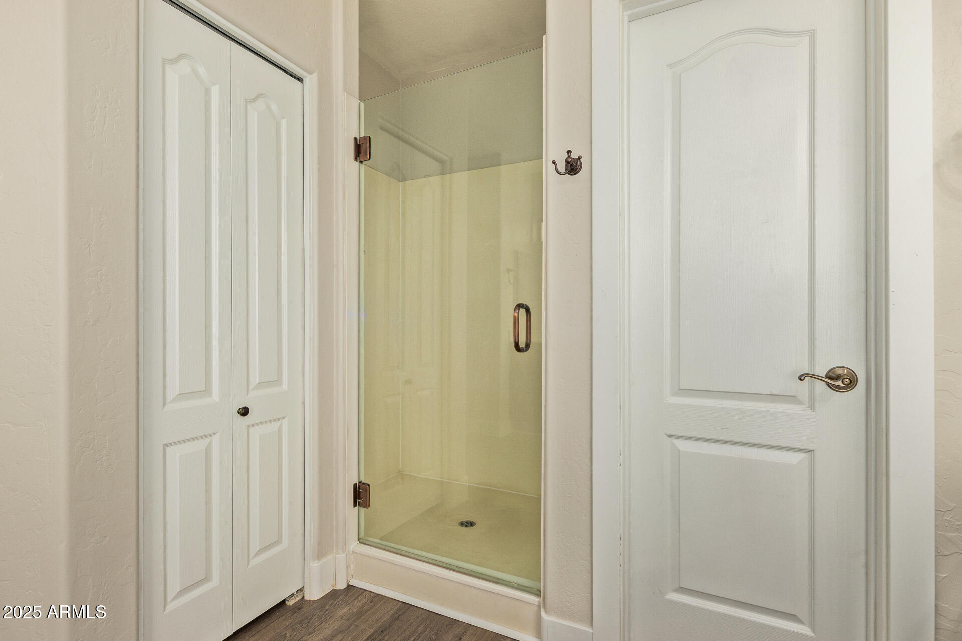 3060 North Ridgecrest, Unit 171 Mesa, AZ 85207 - Photo 19 of 31 a bathroom with a glass shower door