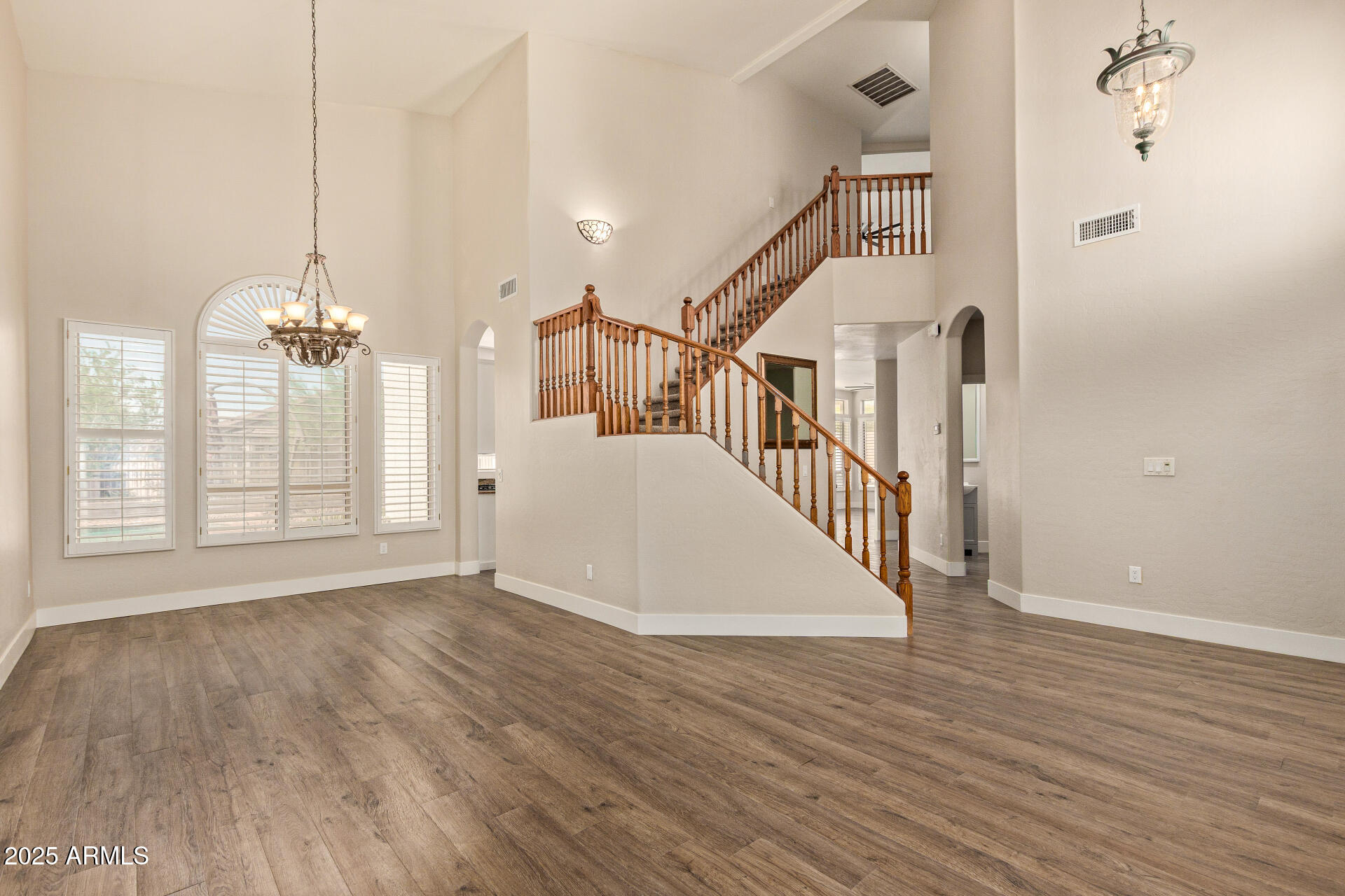 3060 North Ridgecrest, Unit 171 Mesa, AZ 85207 - Photo 2 of 31 a view of a room with wooden floor and windows