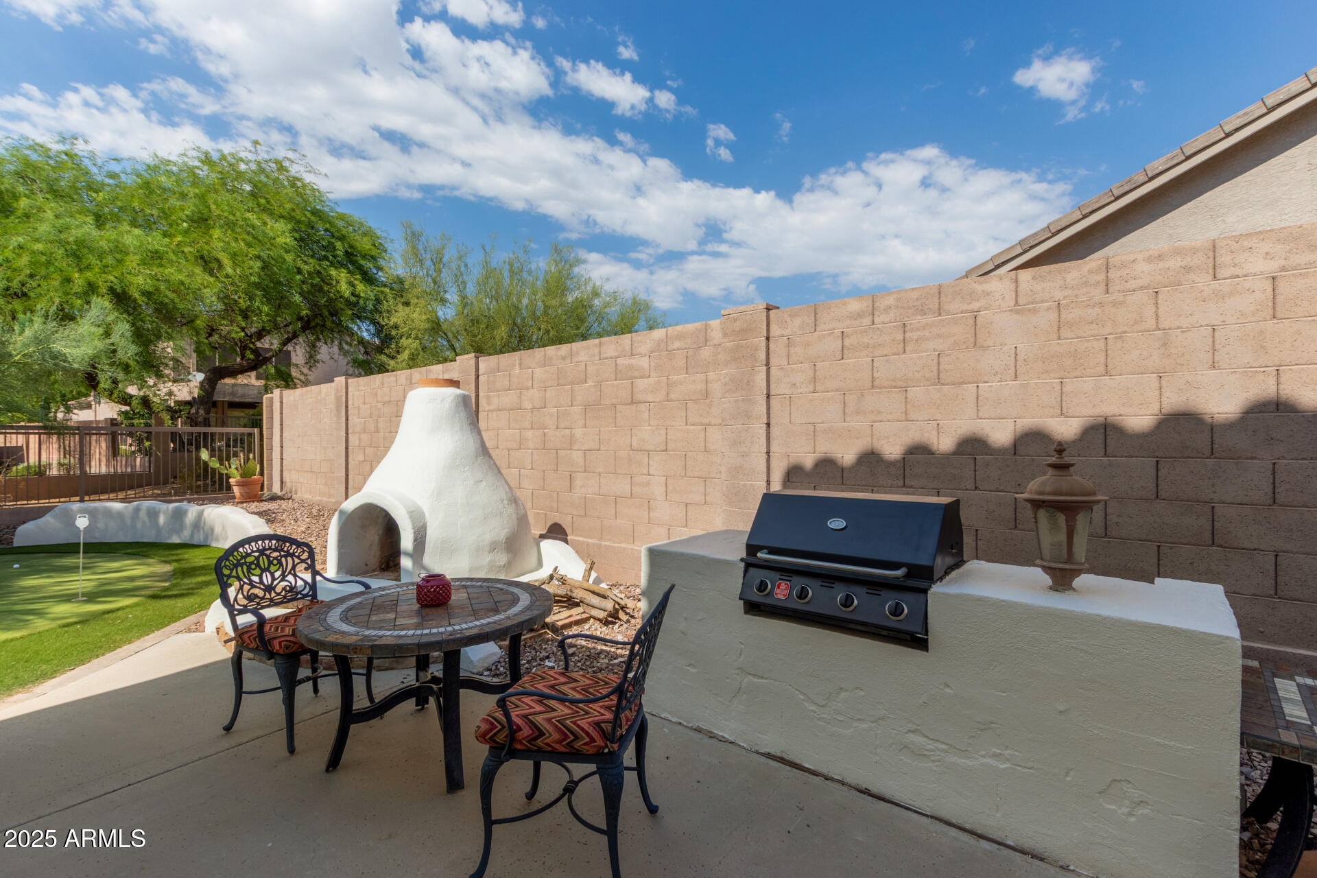 3060 North Ridgecrest, Unit 171 Mesa, AZ 85207 - Photo 26 of 31 a view of outdoor sitting area with furniture and garden