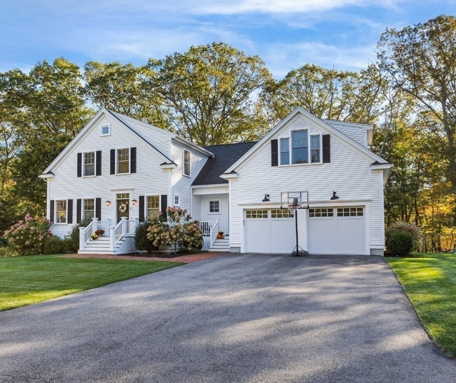 7 Heather Drive Andover, MA 01810 - Photo 1 of 42 a front view of a house with a garden and trees