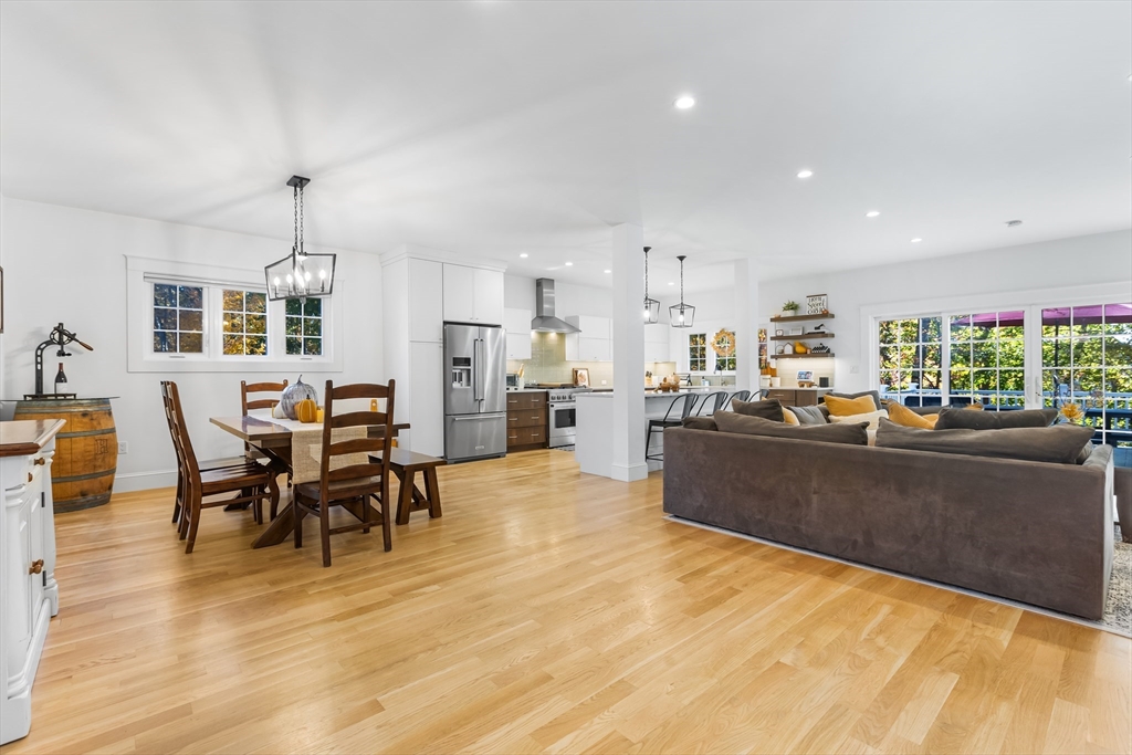 7 Heather Drive Andover, MA 01810 - Photo 16 of 42 a living room with stainless steel appliances kitchen island granite countertop furniture and a dining table