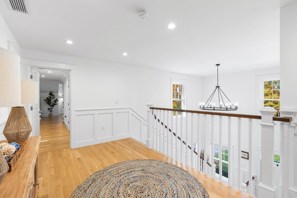 7 Heather Drive Andover, MA 01810 - Photo 20 of 42 a view of entryway and hall with wooden floor