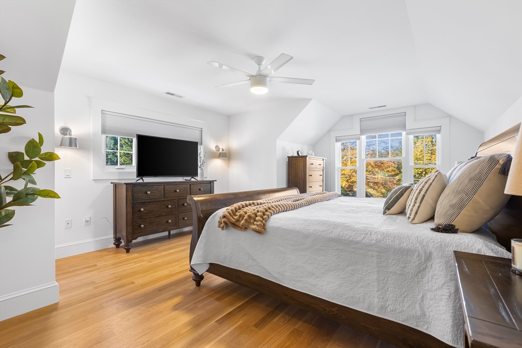 7 Heather Drive Andover, MA 01810 - Photo 22 of 42 a bedroom with a bed and a flat screen tv