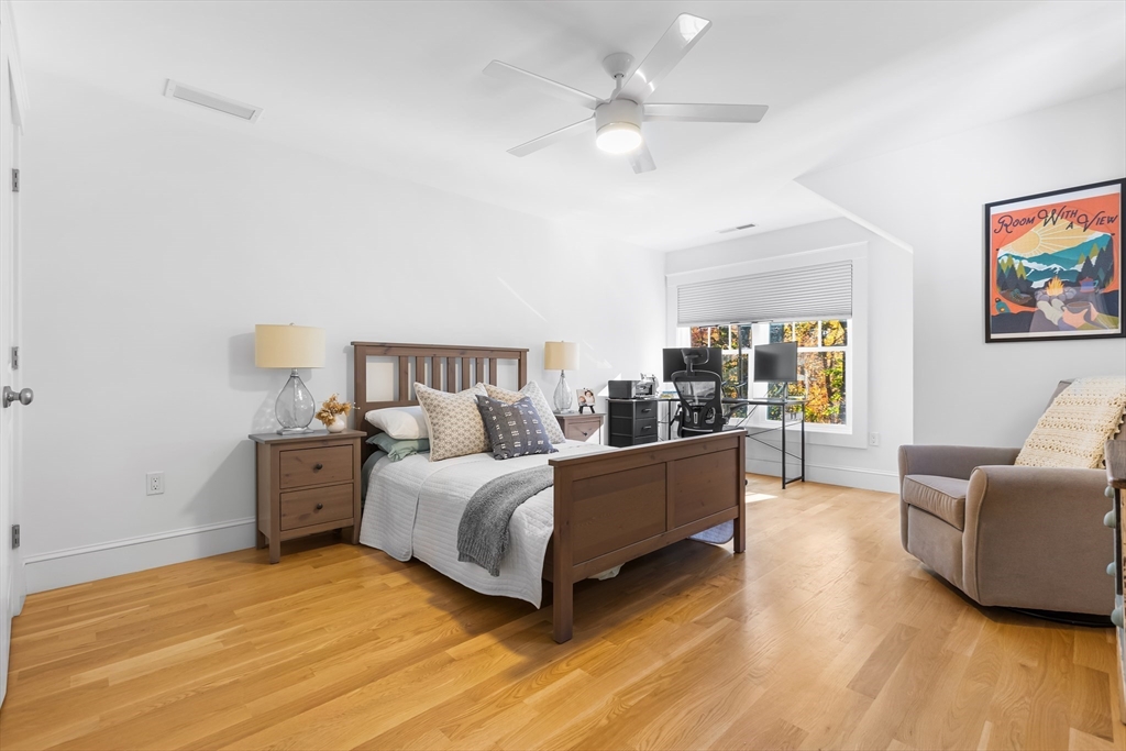 7 Heather Drive Andover, MA 01810 - Photo 27 of 42 a living room with furniture and a chandelier