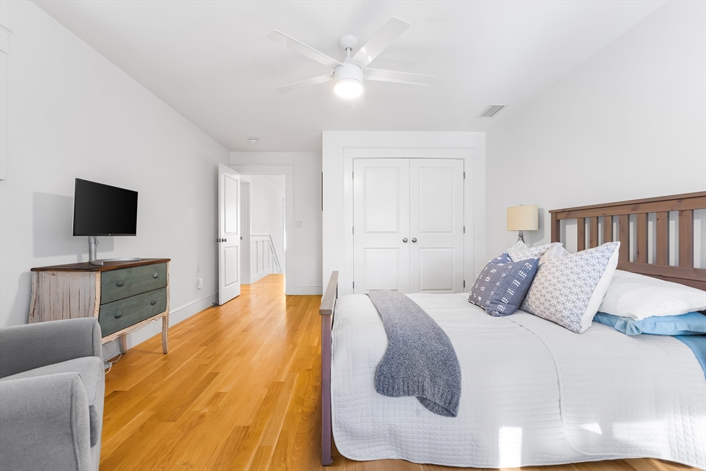 7 Heather Drive Andover, MA 01810 - Photo 28 of 42 a bedroom with a bed and a flat screen tv