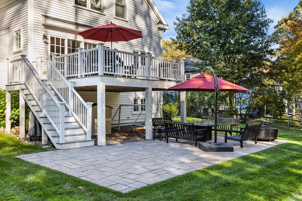 7 Heather Drive Andover, MA 01810 - Photo 3 of 42 a view of a cafe with a table and chairs under an umbrella