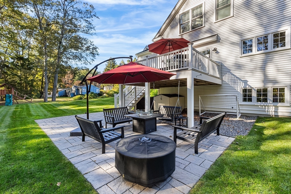 7 Heather Drive Andover, MA 01810 - Photo 40 of 42 a view of a house with backyard sitting area and garden