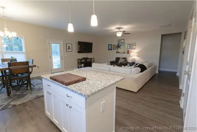 a view of living room with granite countertop furniture and fireplace