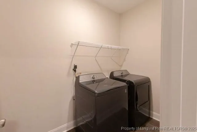 a bathroom with a shower and a glass door