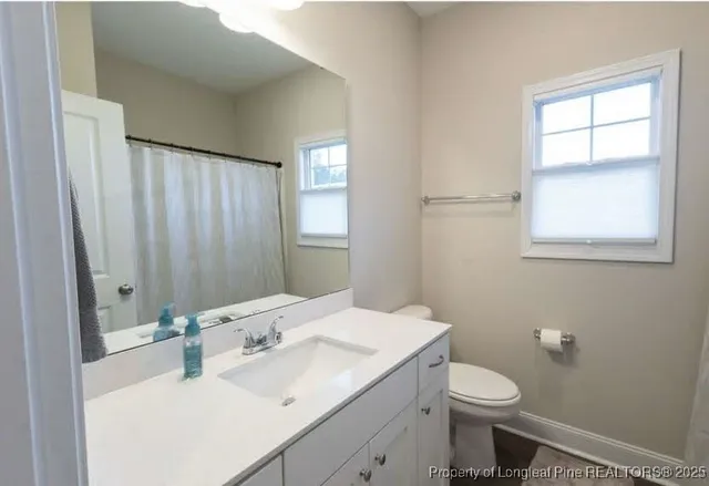 a bedroom with a bed and cabinets