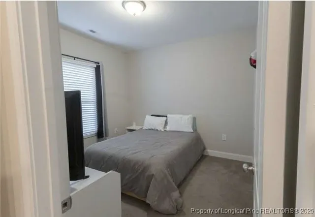 a view of a room with a bathroom