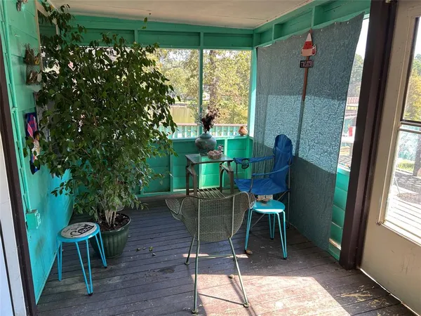 a dining room with furniture window and wooden floor