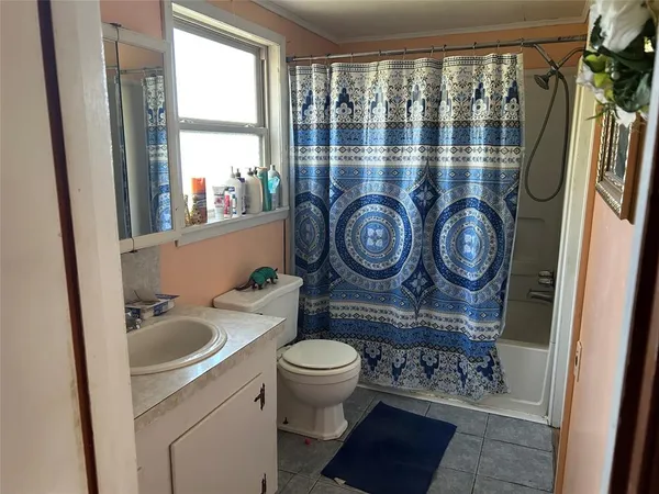 a bathroom with a toilet and a sink