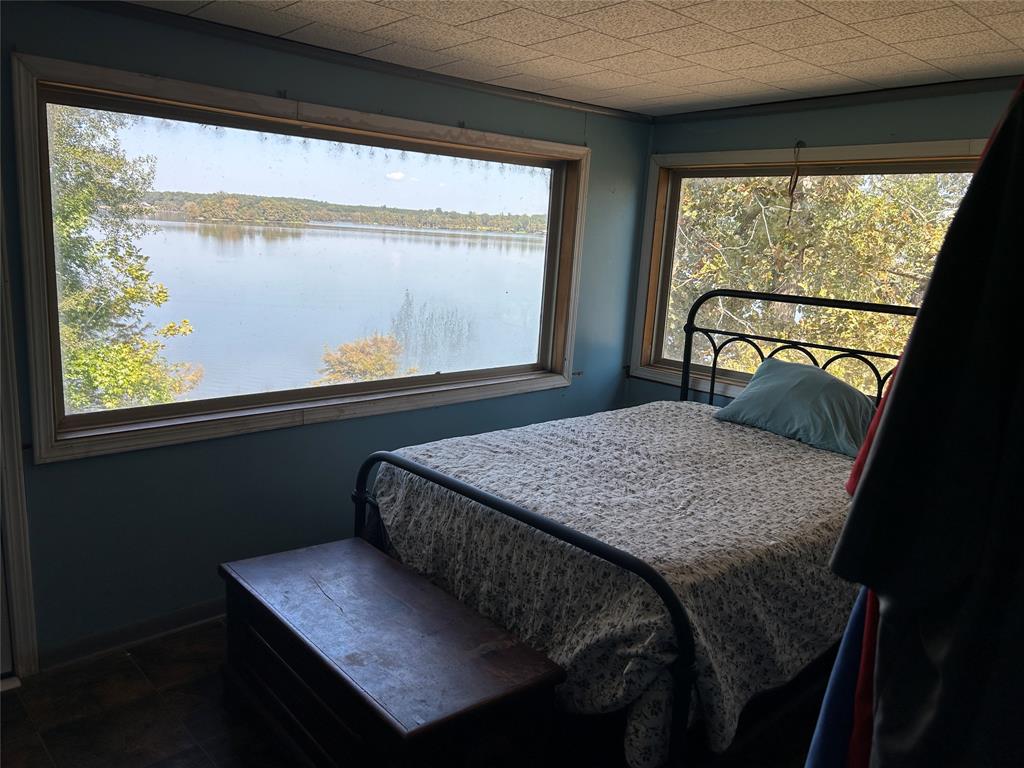 401 Ridge Row Many, LA 71449 - Photo 8 of 20 Bedroom with baseboards and a water view