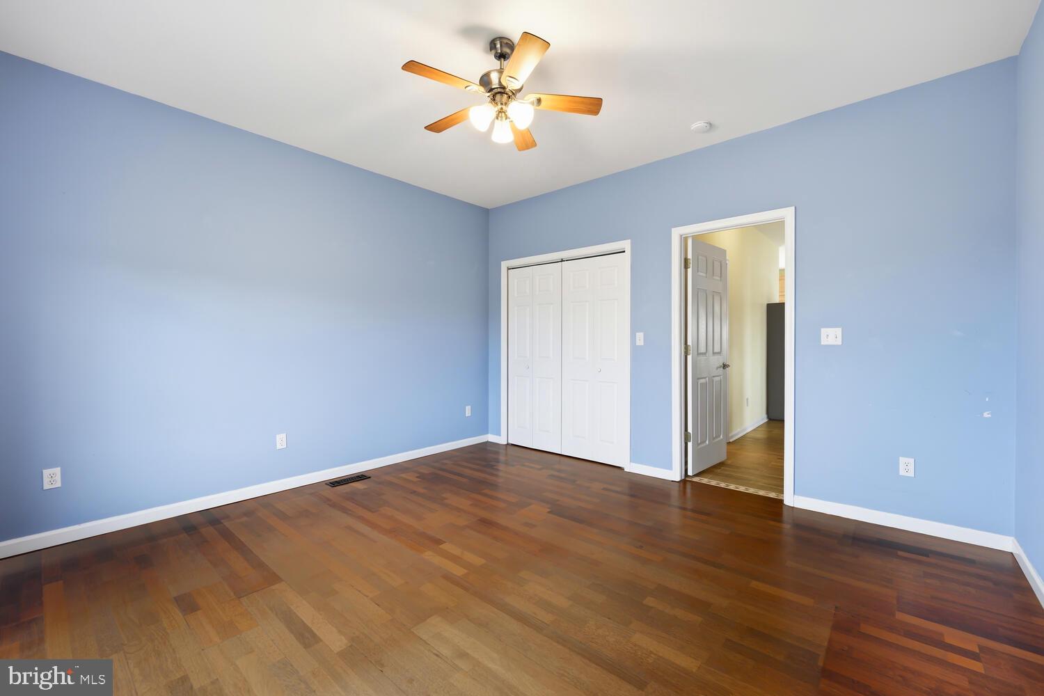 2576 Hoopers Island Road Fishing Creek, MD 21634 - Photo 19 of 43 a view of an empty room with window and wooden floor